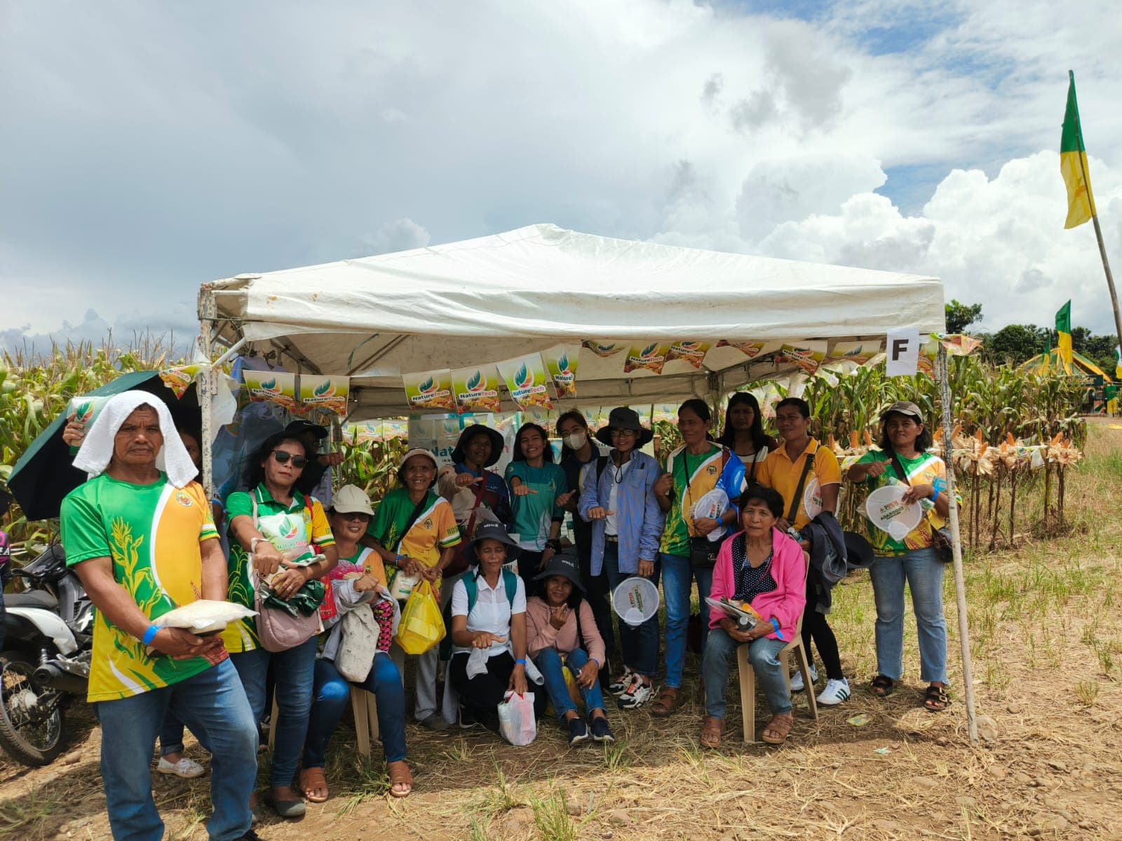 NatureTech team with farmers at a corn field trial day