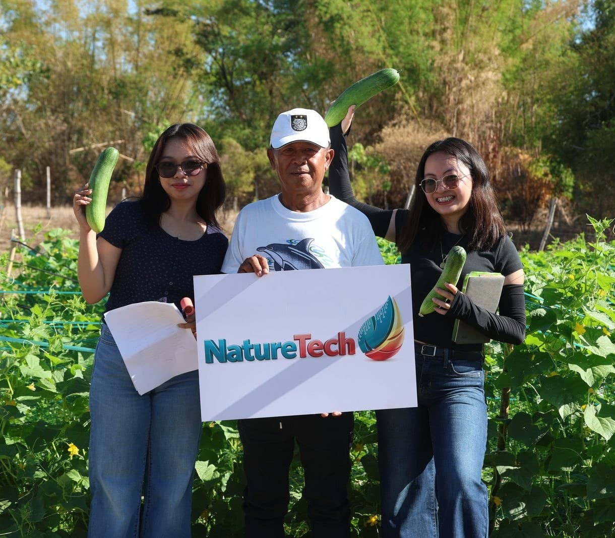 NatureTech team with a partner farmer at a cucumber field trial